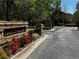 Stone community sign nestled amongst colorful landscaping welcomes you to Lenox Overlook at 1598 Lenox Overlook Ne Rd, Atlanta, GA 30329