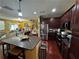 Open kitchen with island, granite countertops, stainless appliances, and adjacent living spaces at 1598 Lenox Overlook Ne Rd, Atlanta, GA 30329