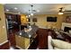 Open concept living area with hardwood floors, fireplace, and kitchen island at 1598 Lenox Overlook Ne Rd, Atlanta, GA 30329