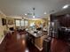 Open concept living area with hardwood floors, a kitchen island, and a cozy fireplace at 1598 Lenox Overlook Ne Rd, Atlanta, GA 30329