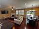 Open concept living area with hardwood floors, fireplace, and dining area at 1598 Lenox Overlook Ne Rd, Atlanta, GA 30329