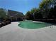 Community pool with decorative clubhouse surrounded by lush greenery and landscaping at 1598 Lenox Overlook Ne Rd, Atlanta, GA 30329