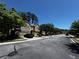 Street view of neighborhood with townhomes, attached garages, and tree-lined street at 1598 Lenox Overlook Ne Rd, Atlanta, GA 30329