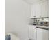Wet bar with marble countertops and white cabinets at 2648 Rivers Nw Rd, Atlanta, GA 30305