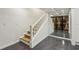 Basement staircase leads to a wine cellar with a polished concrete floor at 2648 Rivers Nw Rd, Atlanta, GA 30305