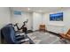 Basement entertainment area includes a stationary bike and custom cabinetry at 2648 Rivers Nw Rd, Atlanta, GA 30305
