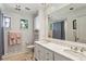 Classic bathroom boasts double sinks with marble counters and a large mirror at 2648 Rivers Nw Rd, Atlanta, GA 30305