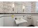 Stylish bathroom with pedestal sink, classic black and white tile, and decorative patterned wallpaper at 2648 Rivers Nw Rd, Atlanta, GA 30305