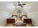 Attic bedroom features shiplap walls, twin beds, and a statement rug at 2648 Rivers Nw Rd, Atlanta, GA 30305