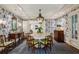 Elegant dining room with patterned wallpaper, a round table, and classic furnishings at 2648 Rivers Nw Rd, Atlanta, GA 30305