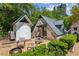 A charming guest house with a brick exterior offers a private retreat and seating area at 2648 Rivers Nw Rd, Atlanta, GA 30305