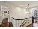Hallway landing featuring a bench seat under an arched window and decorative hanging lights at 2648 Rivers Nw Rd, Atlanta, GA 30305