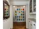 Hallway features charming decorative wall books and recessed lights that brighten the space at 2648 Rivers Nw Rd, Atlanta, GA 30305
