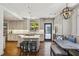 Stylish kitchen features a marble island, a breakfast nook, and stainless appliances at 2648 Rivers Nw Rd, Atlanta, GA 30305