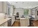 Modern kitchen with white cabinets, stainless steel appliances, and granite countertops at 2648 Rivers Nw Rd, Atlanta, GA 30305