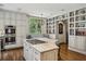 Bright kitchen boasts white cabinets, stainless steel appliances, gas cooktop and marble countertops at 2648 Rivers Nw Rd, Atlanta, GA 30305