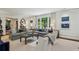 Bright living room with large windows, neutral decor, and a comfortable seating area at 2648 Rivers Nw Rd, Atlanta, GA 30305