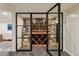 Custom wine cellar with glass doors showcasing ample wine storage at 2648 Rivers Nw Rd, Atlanta, GA 30305