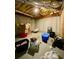 View of an unfinished basement with storage containers and exposed ceiling at 305 Pleasant Forest Dr, Temple, GA 30179