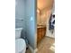 Bathroom featuring a vanity with wood cabinets, neutral wall color, and tile flooring at 305 Pleasant Forest Dr, Temple, GA 30179