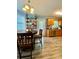 Bright eat-in kitchen boasts modern appliances, wooden cabinets, and functional shelving at 305 Pleasant Forest Dr, Temple, GA 30179