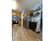 Efficient kitchen features stainless appliances, sleek cabinets, and modern hanging pot rack at 305 Pleasant Forest Dr, Temple, GA 30179