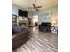 Inviting living space with modern flooring, stone fireplace, and vaulted ceilings at 305 Pleasant Forest Dr, Temple, GA 30179