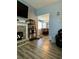 Bright living room shows the stone fireplace and seamless flow into the dining area at 305 Pleasant Forest Dr, Temple, GA 30179