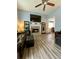 Open-concept living room offers a cozy stone fireplace and bright natural light at 305 Pleasant Forest Dr, Temple, GA 30179