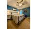 Inviting main bedroom featuring a tray ceiling and a large black metal bed frame at 305 Pleasant Forest Dr, Temple, GA 30179