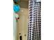 Shower and tub combination with a black and white checkered shower curtain at 305 Pleasant Forest Dr, Temple, GA 30179