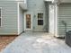 Concrete patio in backyard has ample space for outdoor dining and entertaining near the lush yard at 4643 Grand Central Pkwy, Decatur, GA 30035
