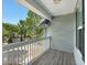 View of the balcony with white railings and a wooden floor at 4643 Grand Central Pkwy, Decatur, GA 30035