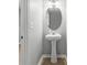Charming half-bath with pedestal sink and modern fixtures at 4643 Grand Central Pkwy, Decatur, GA 30035