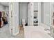 Bathroom featuring a vanity with a sink, a toilet, and a doorway to the closet at 4643 Grand Central Pkwy, Decatur, GA 30035