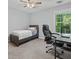 Cozy bedroom with a twin bed, desk, and bright window at 4643 Grand Central Pkwy, Decatur, GA 30035
