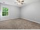 Bright bedroom with neutral walls and soft carpeting at 4643 Grand Central Pkwy, Decatur, GA 30035