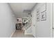 Bright entryway with neutral walls and flooring leading into a living space with a cozy fireplace at 4643 Grand Central Pkwy, Decatur, GA 30035
