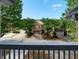 View of the homes in the community from the porch with green trees in the background at 4643 Grand Central Pkwy, Decatur, GA 30035