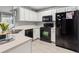 Functional kitchen with white cabinets, modern appliances, and a light countertop for meal preparation at 4643 Grand Central Pkwy, Decatur, GA 30035