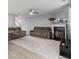 Spacious living room with neutral decor, a fireplace, plush sofas, and plenty of natural light at 4643 Grand Central Pkwy, Decatur, GA 30035