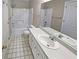 Well-lit bathroom with a combination shower and tub, and single vanity at 3510 Beaver Cove Rd, Cumming, GA 30041