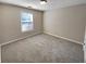 A well-lit bedroom with neutral walls and carpet, offering a serene and comfortable space at 3510 Beaver Cove Rd, Cumming, GA 30041