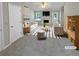 Bright, staged living room with fireplace, large windows, and comfortable furniture at 3510 Beaver Cove Rd, Cumming, GA 30041