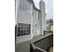 Back porch with railing and gray siding on townhome at 1703 Feast Ct, Cumming, GA 30040