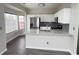 Kitchen boasts stainless appliances, granite countertops, and a breakfast nook with bay window at 1703 Feast Ct, Cumming, GA 30040