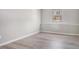 This bedroom has gray walls, gray vinyl floors, and a small window at 1703 Laurel Creek Cir, Lithonia, GA 30058