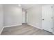 This bedroom has gray walls, gray vinyl floors, and a white door at 1703 Laurel Creek Cir, Lithonia, GA 30058