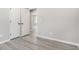 This bedroom has gray walls, gray vinyl floors, and a double closet at 1703 Laurel Creek Cir, Lithonia, GA 30058
