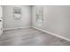 This bedroom has gray walls, gray vinyl floors, and a window at 1703 Laurel Creek Cir, Lithonia, GA 30058